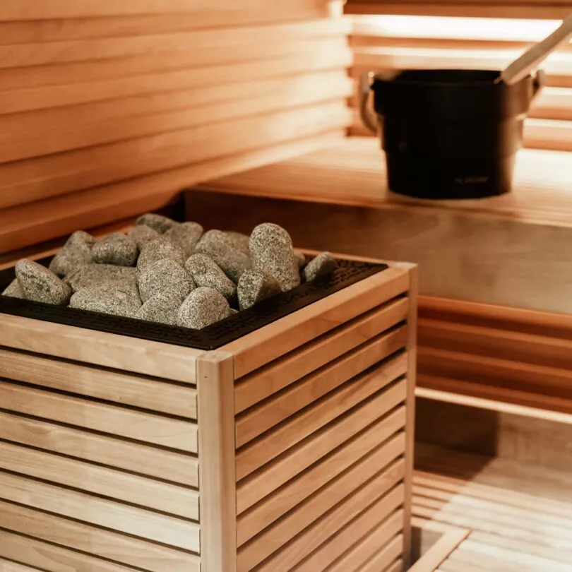 HUUM CORE Electric Sauna Heater, 6 kW · Wood panels — installed in a sauna