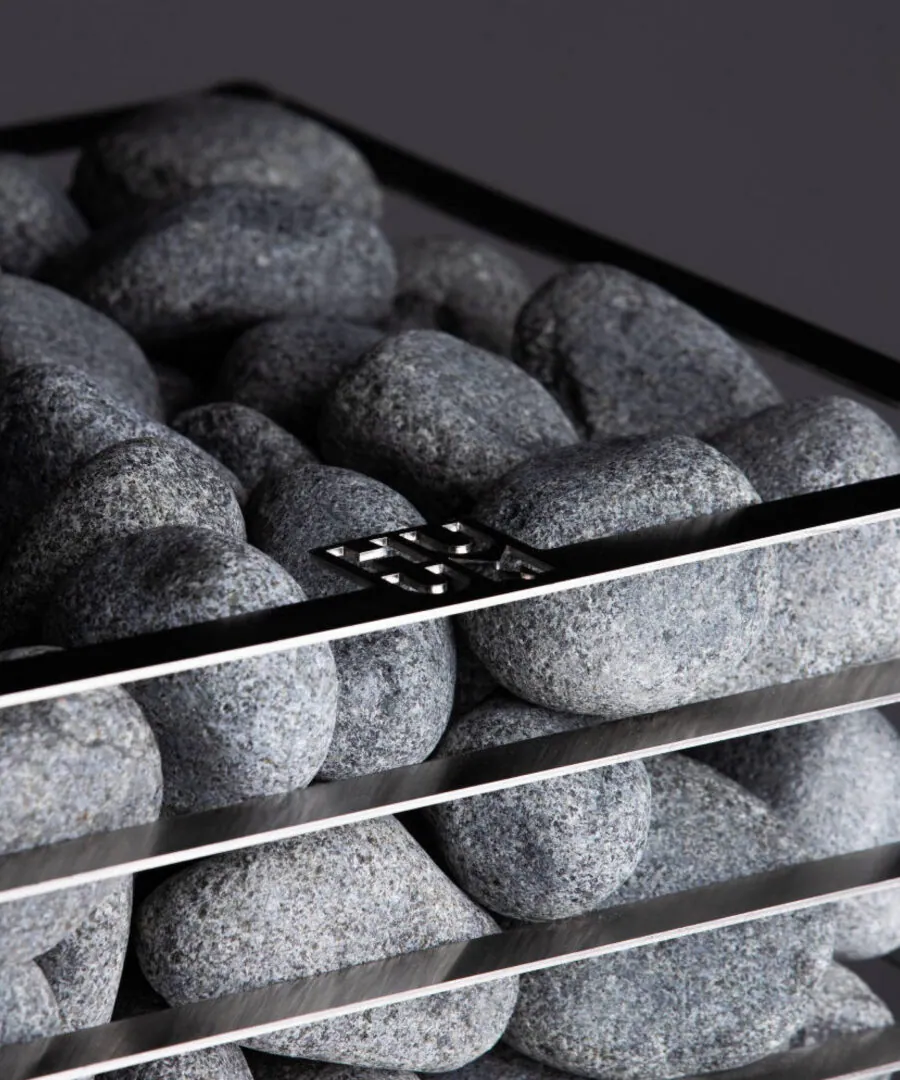 Rounded Olivine Diabase Sauna Stones, 5–10 cm (15 kg box) — installed in a sauna
